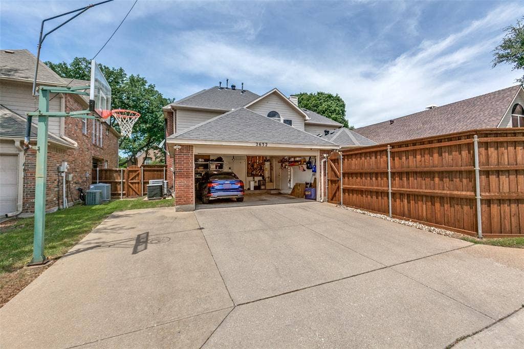2632 Barrington Drive, Plano, TX 75093 Attached two-car garage and extra parking area