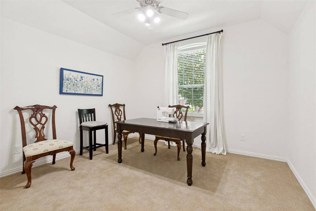 2632 Barrington Drive, Plano, TX 75093 Upstairs bedroom with a vaulted ceiling and a ceiling fan