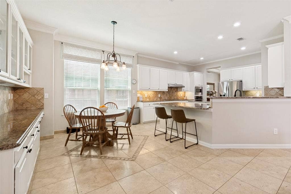 2632 Barrington Drive, Plano, TX 75093 Spacious open and flowing kitchen and breakfast room feature tremendous storage and a huge walk in pantry.