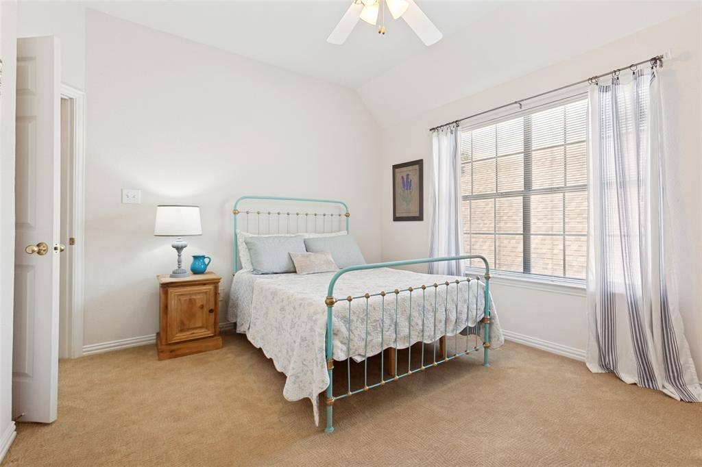 2632 Barrington Drive, Plano, TX 75093 Upstairs split bedroom featuring a vaulted ceiling and a ceiling fan