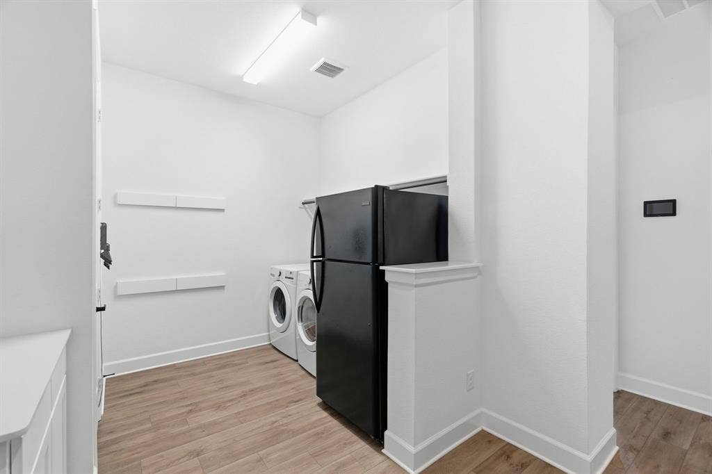 laundry room with 2 storage closets