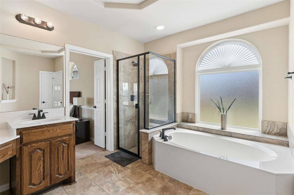 2446 Old Stables Drive, Celina, TX 75009 Bathroom featuring a shower stall, vanity, and a bath