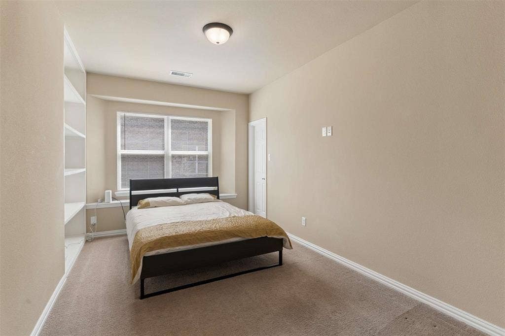 2446 Old Stables Drive, Celina, TX 75009 Bedroom featuring light colored carpet and baseboards