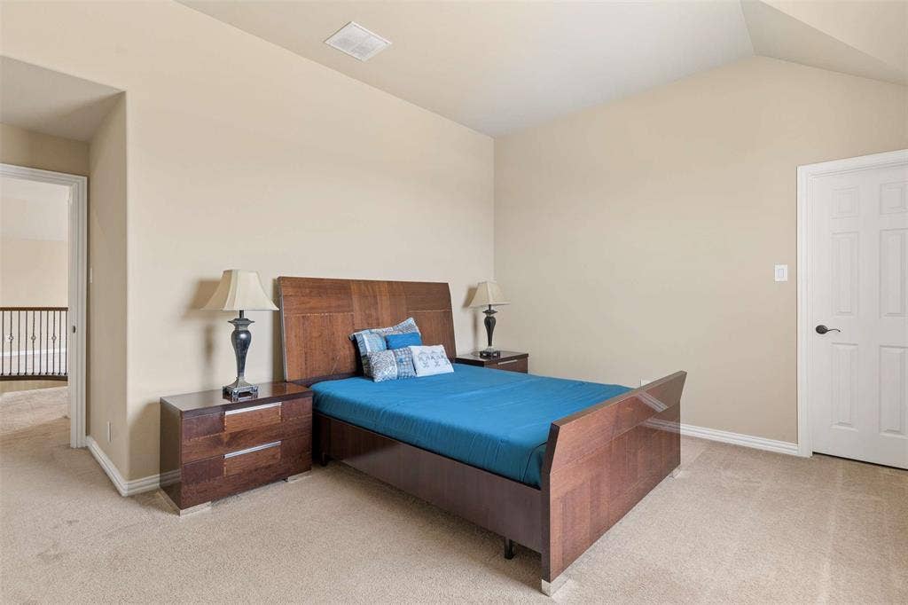 2446 Old Stables Drive, Celina, TX 75009 Bedroom featuring light colored carpet and vaulted ceiling