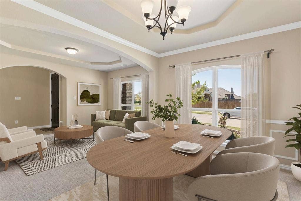 2446 Old Stables Drive, Celina, TX 75009 Formal dining area with tray ceiling and chandelier