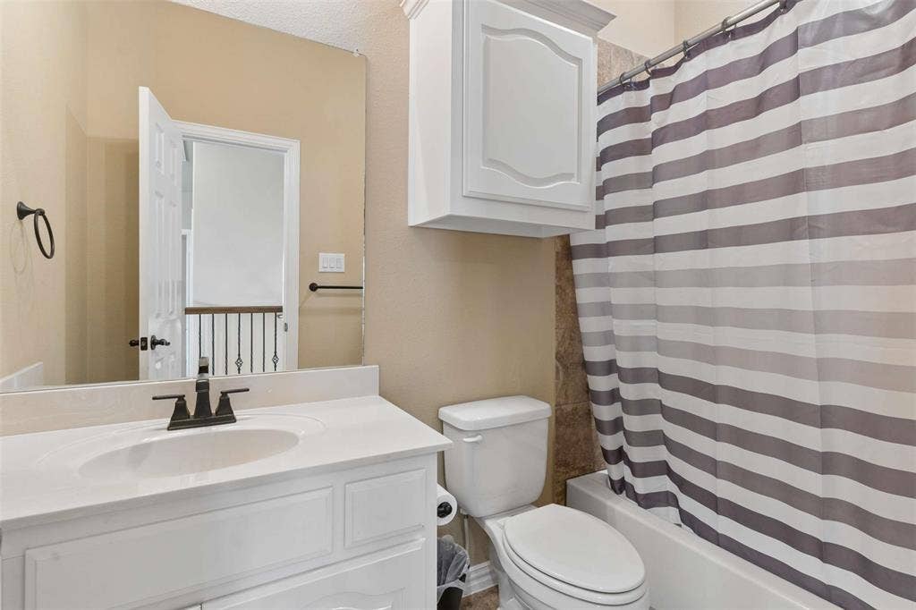 2446 Old Stables Drive, Celina, TX 75009 Bathroom featuring vanity and shower / bath combo with shower curtain