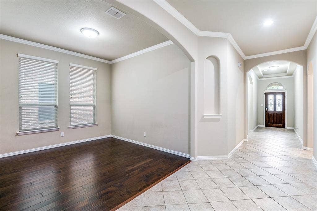 16425 Toledo Bend Court, Prosper, TX 75078 Entryway with arched walkways, crown molding, and light wood-style floors