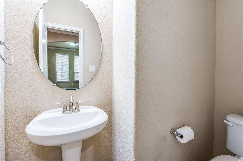 16425 Toledo Bend Court, Prosper, TX 75078 Half bath with toilet and a sink