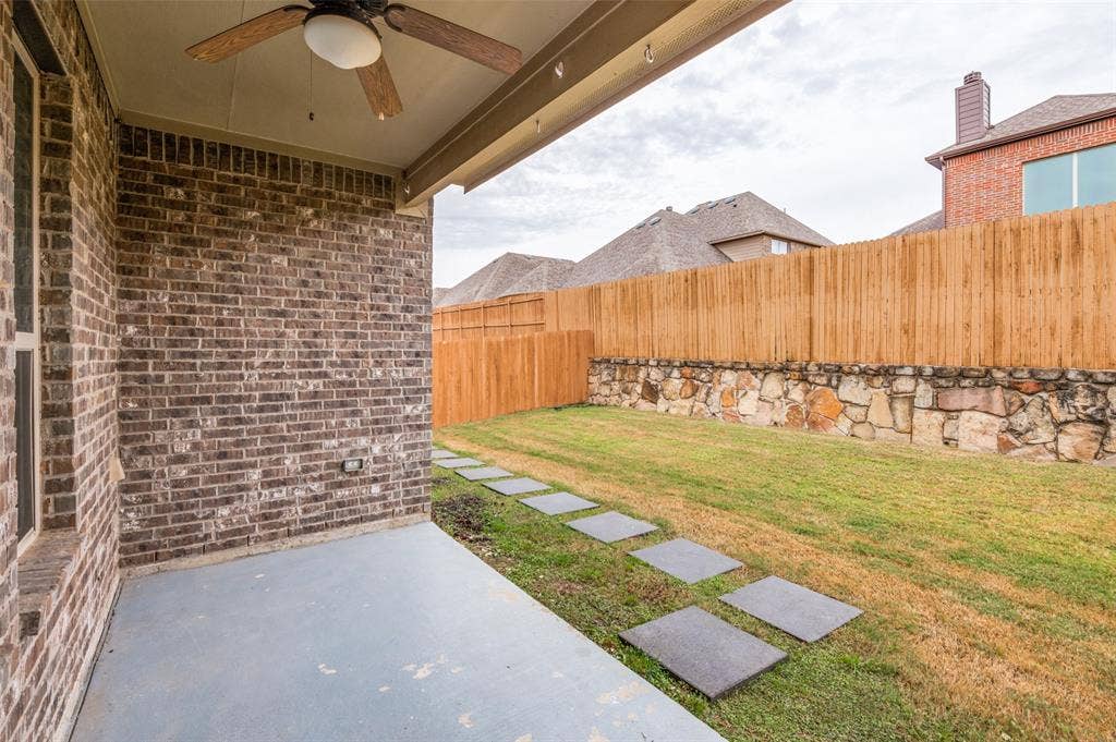 16425 Toledo Bend Court, Prosper, TX 75078 Fenced backyard featuring a ceiling fan and a patio
