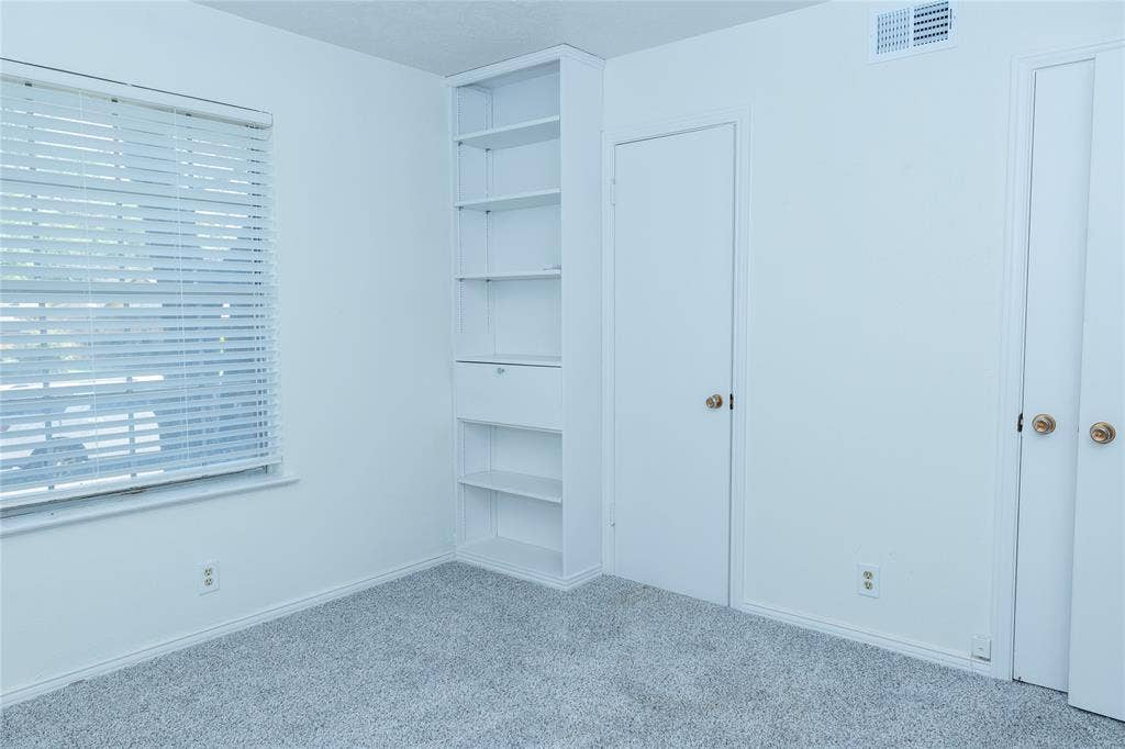 1860 Meadow Valley Lane, Dallas, TX 75232 Built in bookcase in this room.