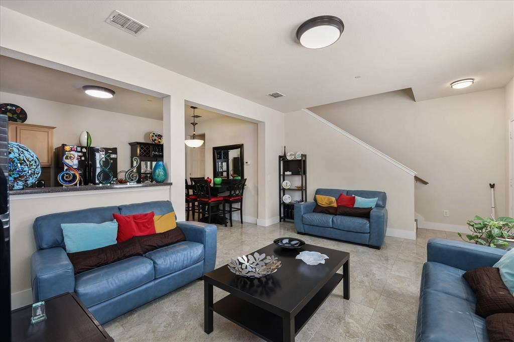 3025 Stone Forest Circle, McKinney, TX 75070 Living area featuring stairs and baseboards