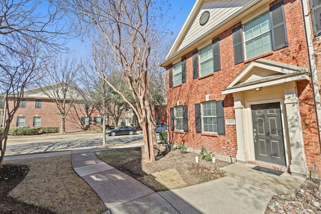 3025 Stone Forest Circle, McKinney, TX 75070 Property entrance featuring brick siding