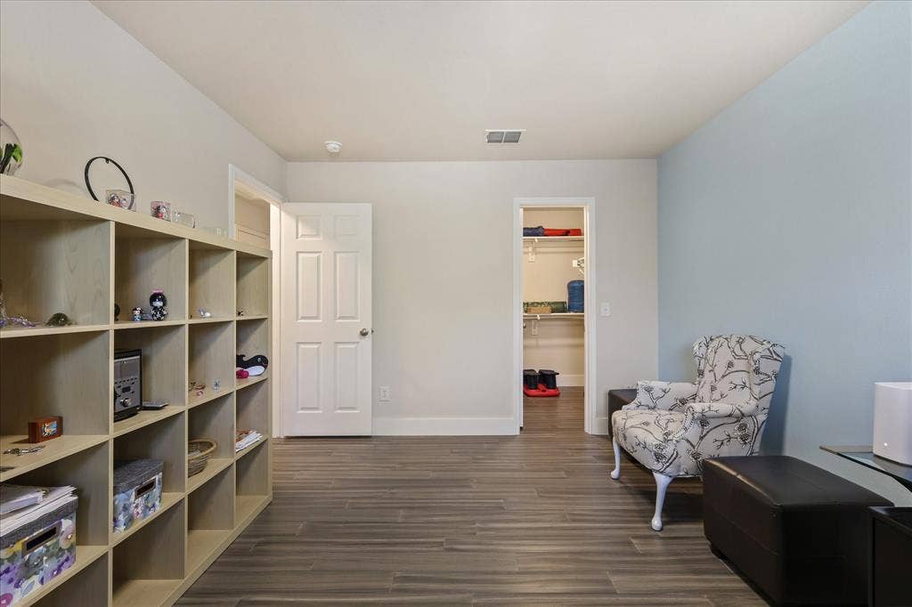 3025 Stone Forest Circle, McKinney, TX 75070 Sitting room featuring dark wood-type flooring and baseboards