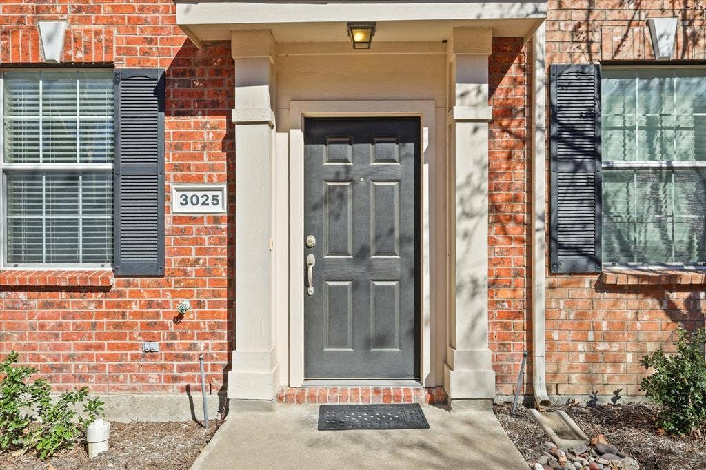 3025 Stone Forest Circle, McKinney, TX 75070 Doorway to property featuring brick siding
