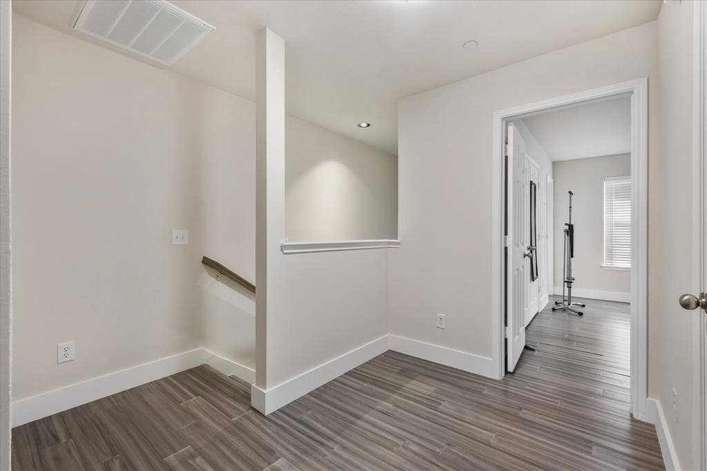 3025 Stone Forest Circle, McKinney, TX 75070 Hall featuring baseboards and dark wood finished floors