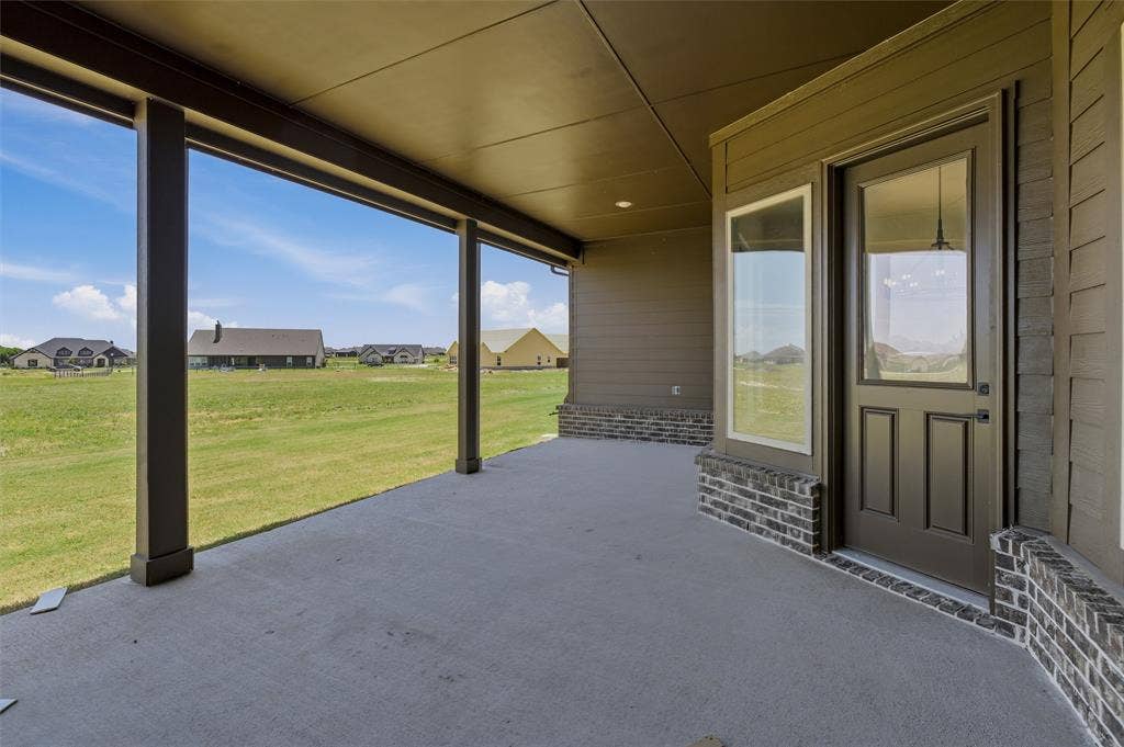 2408 Quartz Street, Krum, TX 76249 Covered patio featuring a concrete slab and support columns