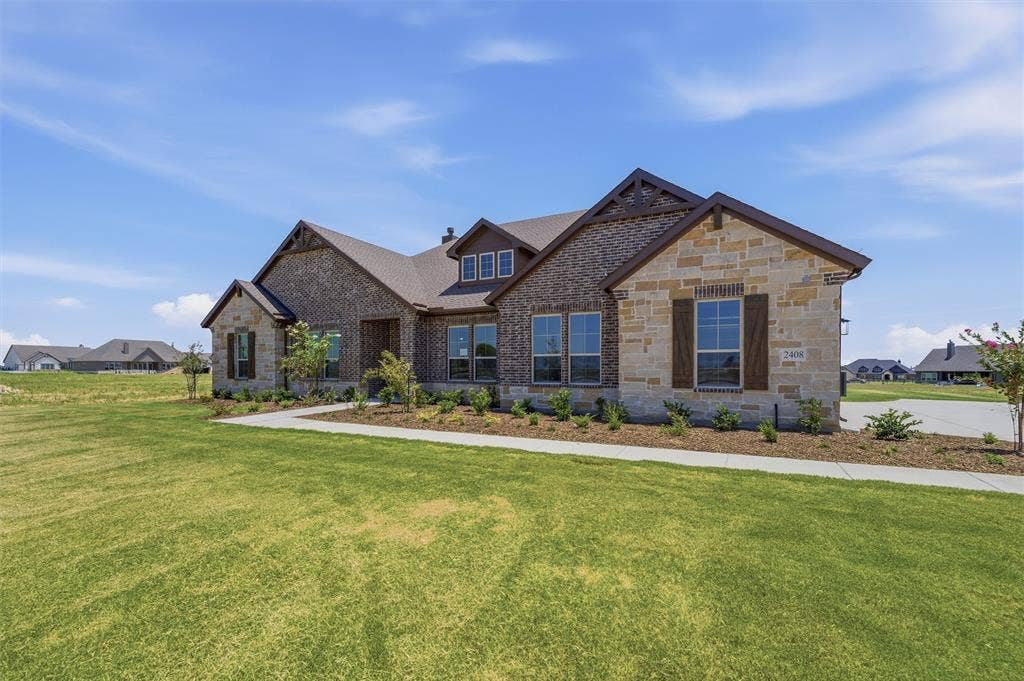 2408 Quartz Street, Krum, TX 76249 Stone and brick exterior with contrasting roof lines
