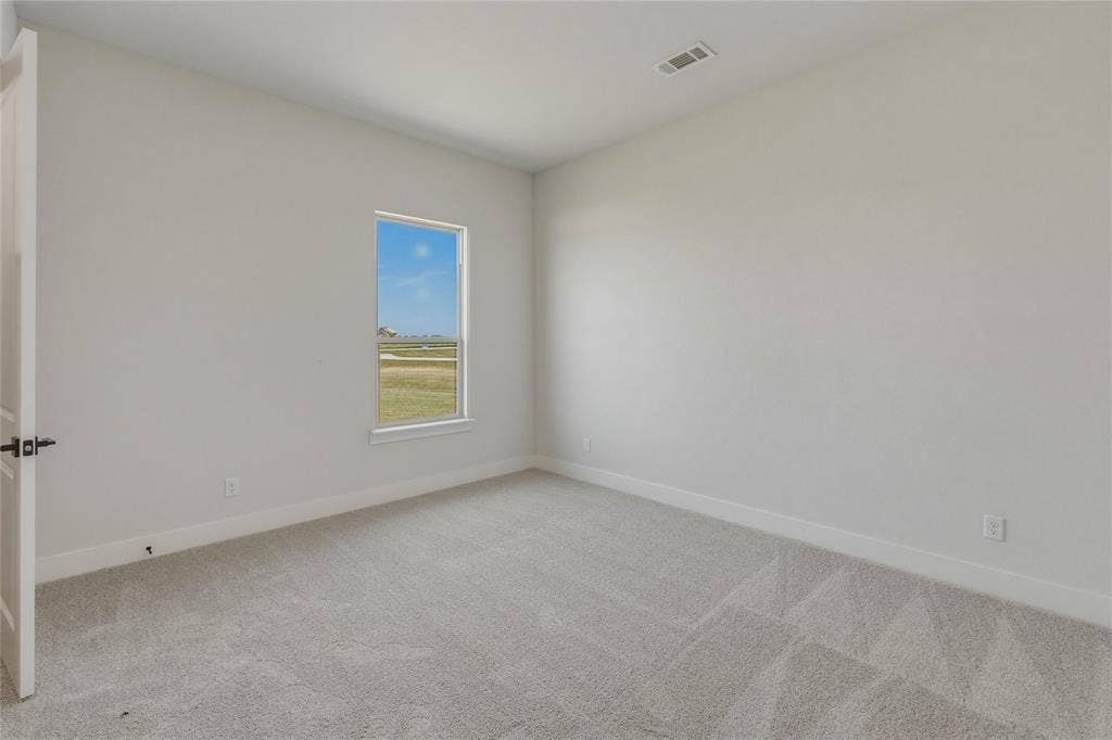 2305 Gypsum Street, Krum, TX 76249 Carpeted interior room with light gray walls
