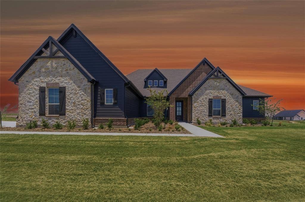 2305 Gypsum Street, Krum, TX 76249 Stone and dark siding exterior with prominent gables and dark window shutters