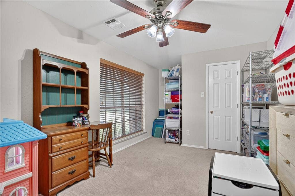 5212 Whisper Drive, Fort Worth, TX 76123 Interior room featuring light gray walls, plush carpet flooring, and a ceiling fan with light fixture