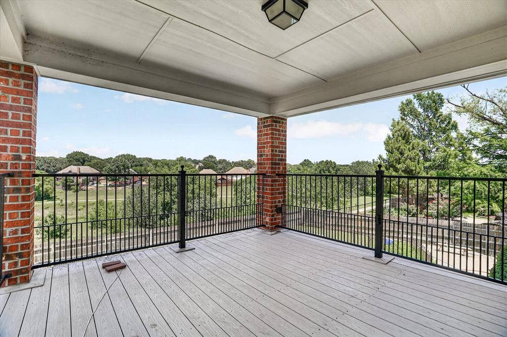 5212 Whisper Drive, Fort Worth, TX 76123 Covered outdoor balcony featuring composite decking and an open metal railing system