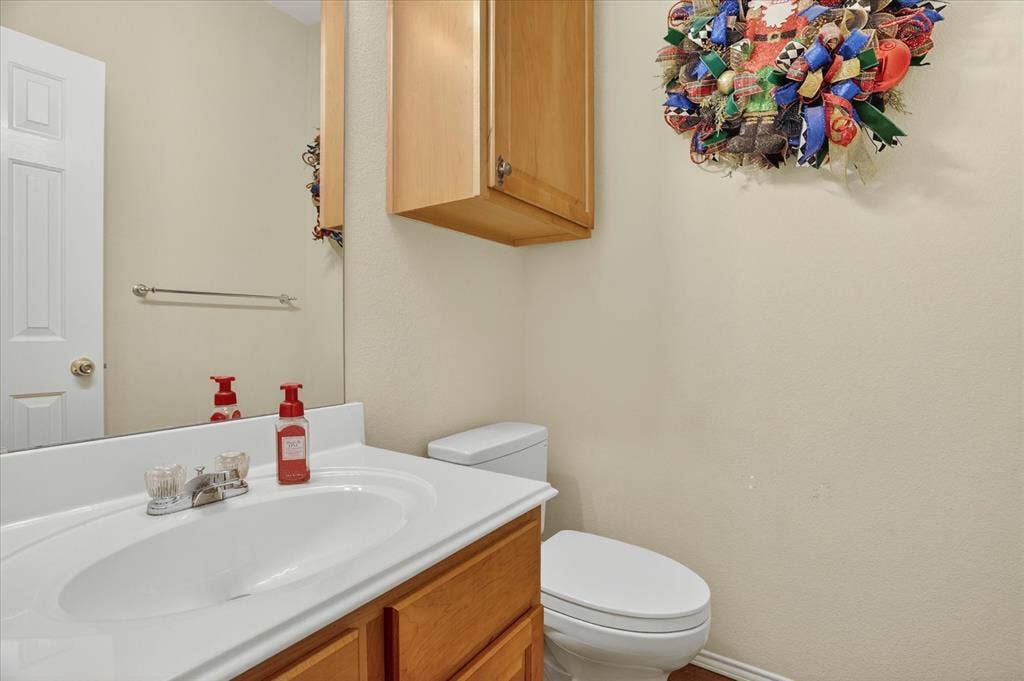 5212 Whisper Drive, Fort Worth, TX 76123 Vanity with a white integrated sink and laminate countertop
