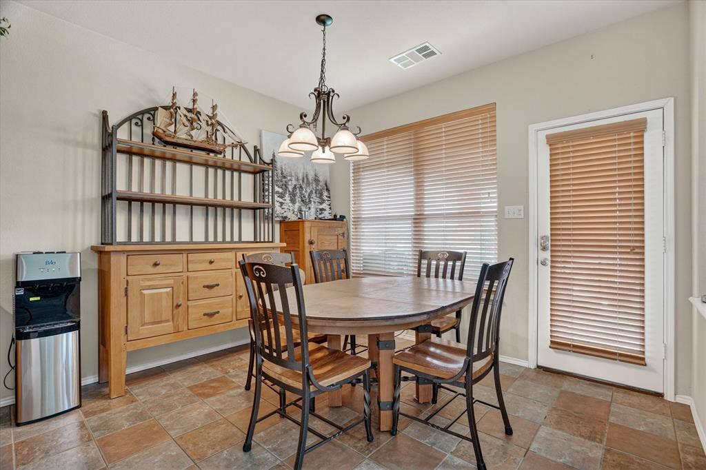 5212 Whisper Drive, Fort Worth, TX 76123 Dining area featuring multi-toned tile flooring and neutral wall paint