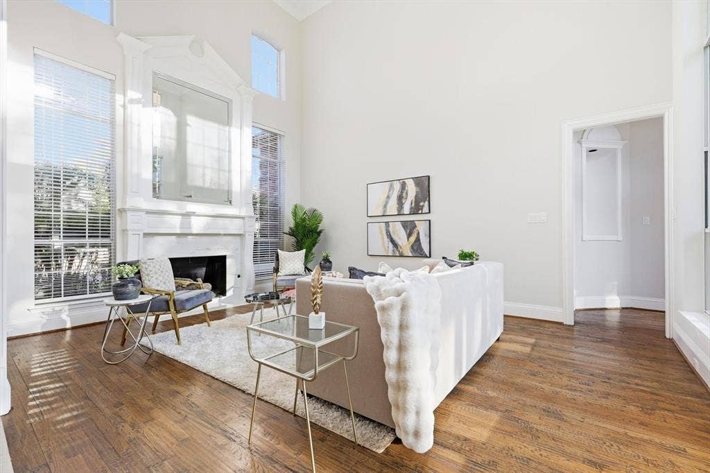 Light-filled front living room with view of back yard.