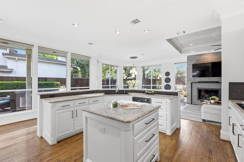 Oversized kitchen with gas stove, double ovens and open concept to living and casual dining. Perfect for entertaining or comfortably suiting your family.