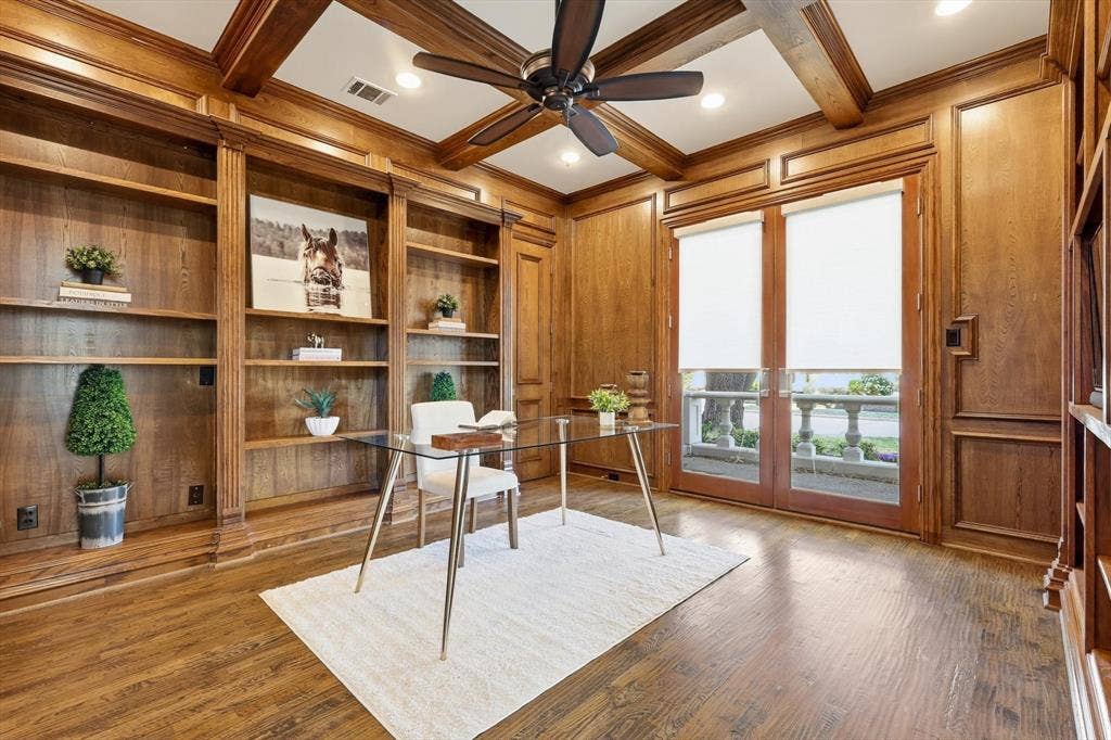 Large office with lockable closet on front of home with patio.