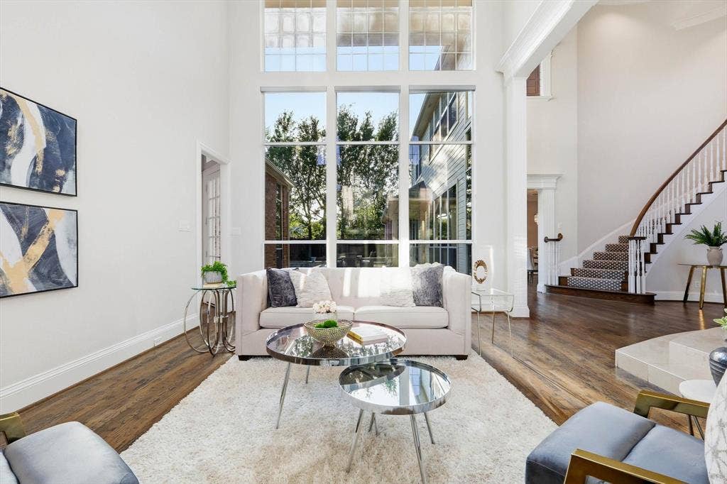 Light-filled front living room with view of back yard.