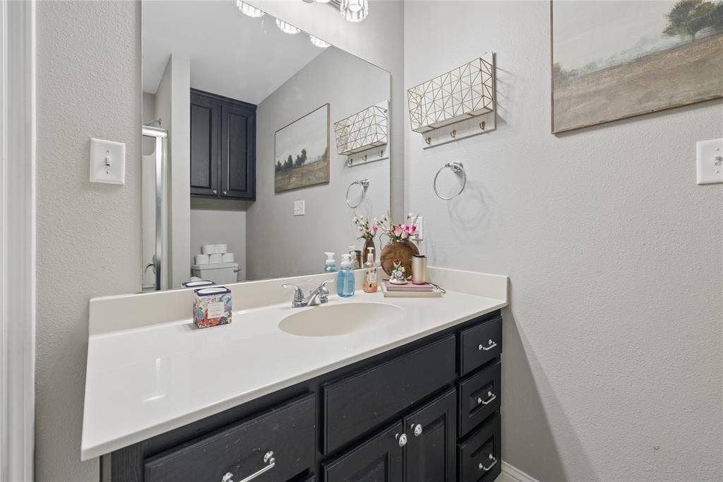 25 Starview Drive, Star Harbor, TX 75148 Bathroom with a textured wall and vanity