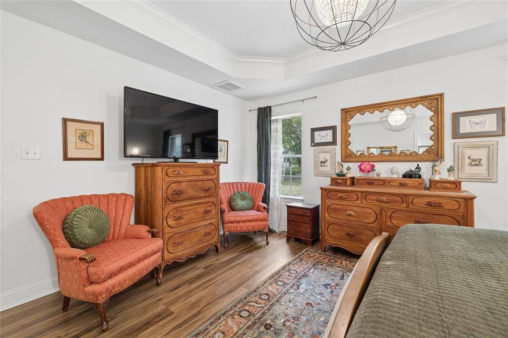 25 Starview Drive, Star Harbor, TX 75148 Bedroom with ornamental molding, wood finished floors, and suspended lighting