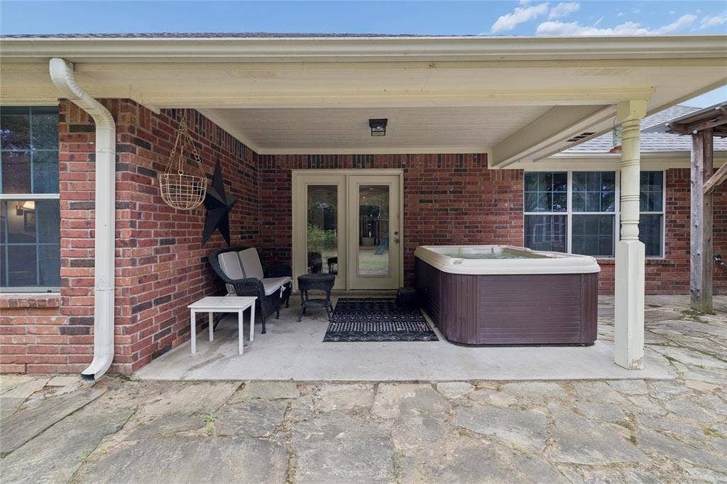 25 Starview Drive, Star Harbor, TX 75148 View of patio featuring a hot tub