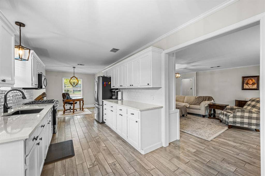 The open floor plan flows seamlessly between the living room and kitchen.