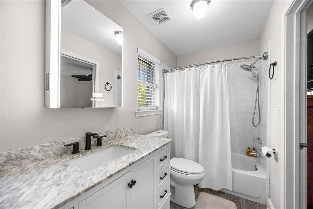 Jack and jill bathroom connecting bedrooms 2 and 3.