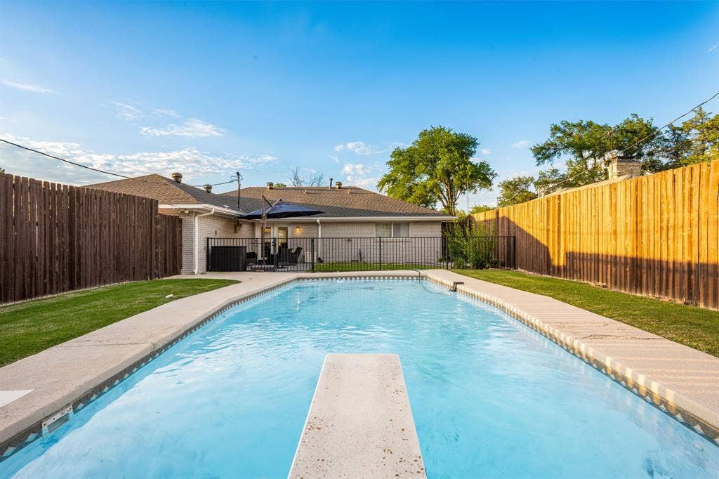 The pool has a diving board.