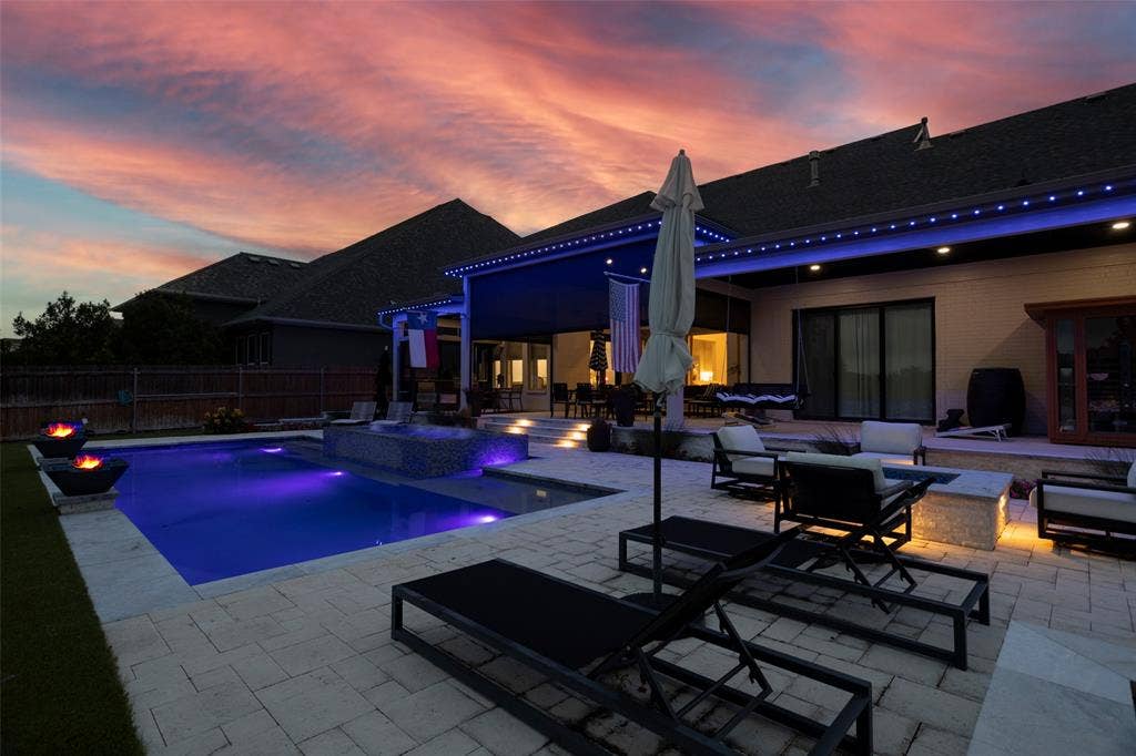 405 Point Vista Drive, Aledo, TX 76008 Fire pit & fire pots surround pool. Door from primary with direct access to backyard.