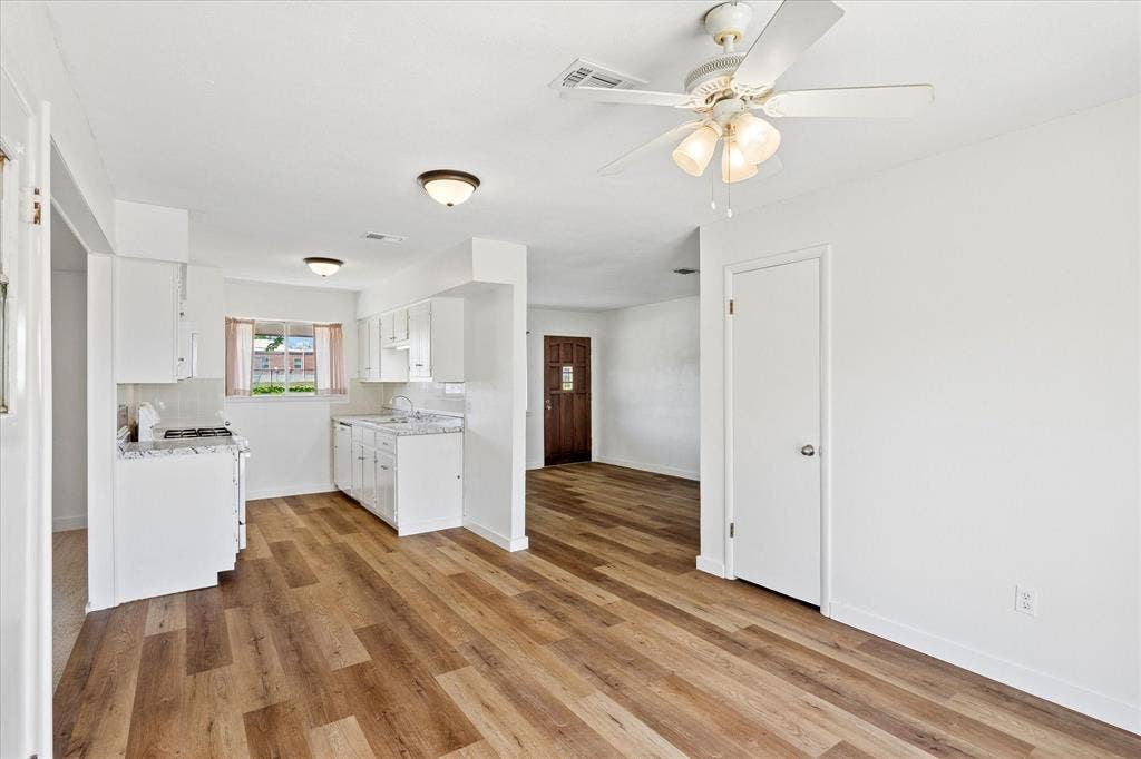 5820 Shipp Drive, Watauga, TX 76148 interior featuring wood-finish flooring and a white color palette