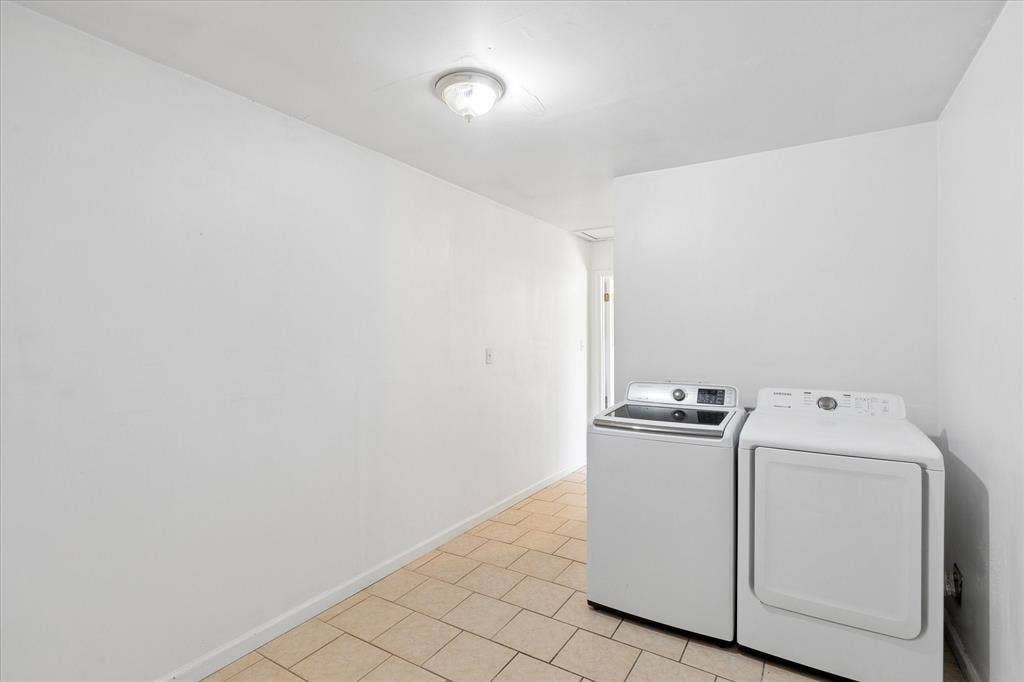 5820 Shipp Drive, Watauga, TX 76148 Dedicated laundry area featuring tile is flooring, white walls, and a ceiling-mounted light fixture is 8x18 great size includes storage space