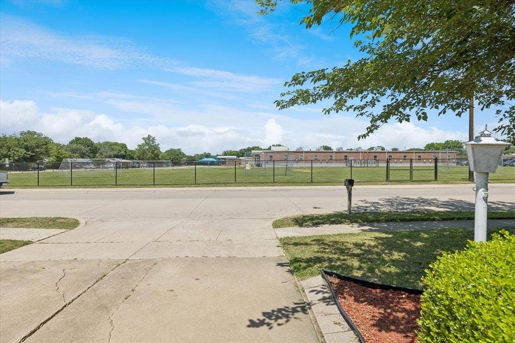 5820 Shipp Drive, Watauga, TX 76148 Expansive green field visible from the property
