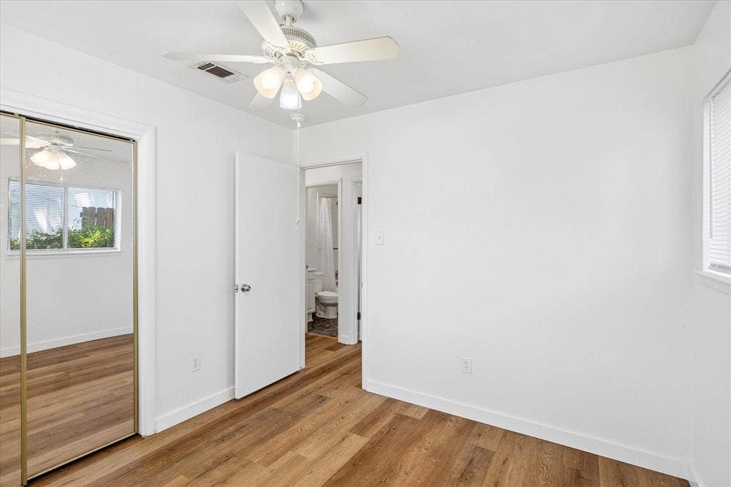 5820 Shipp Drive, Watauga, TX 76148 Room featuring wood-finish flooring, a ceiling fan, and white walls