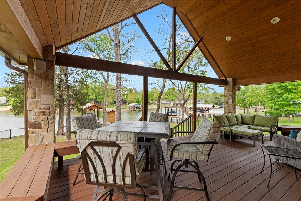 122 Lake Terrace Drive, Mabank, TX 75156 Spacious covered deck overlooking lovely treed yard and peaceful cove view.