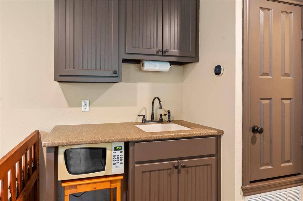 122 Lake Terrace Drive, Mabank, TX 75156 Wet bar with microwave and space for beverage refrigerator.