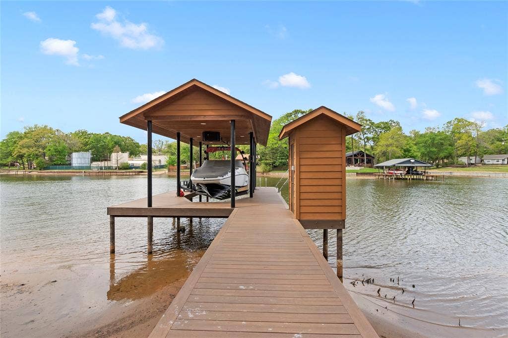 122 Lake Terrace Drive, Mabank, TX 75156 Boathouse with slip plus lake pump sprinkler system.