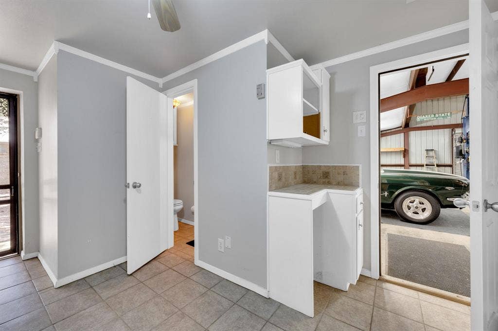 Full bathroom and Flex space located in workshop.