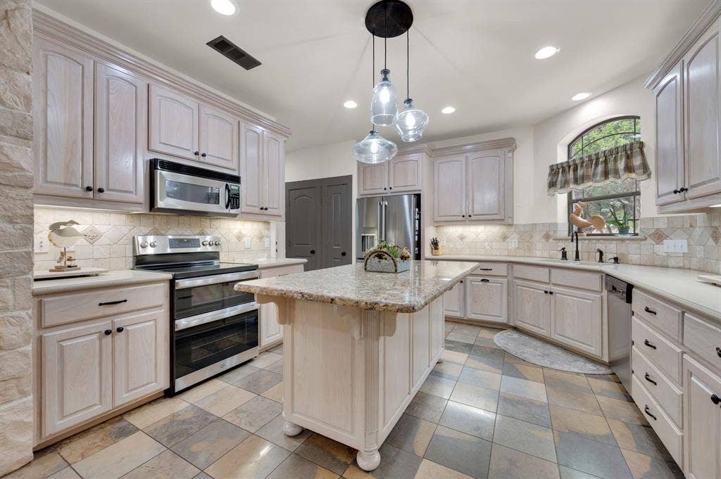 Bright kitchen with stainless appliances and ample counter space