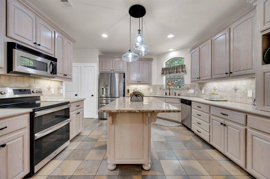 Kitchen with expansive island and open concept design