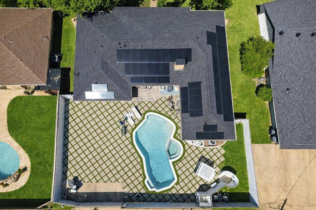 View of subject property with a pool area