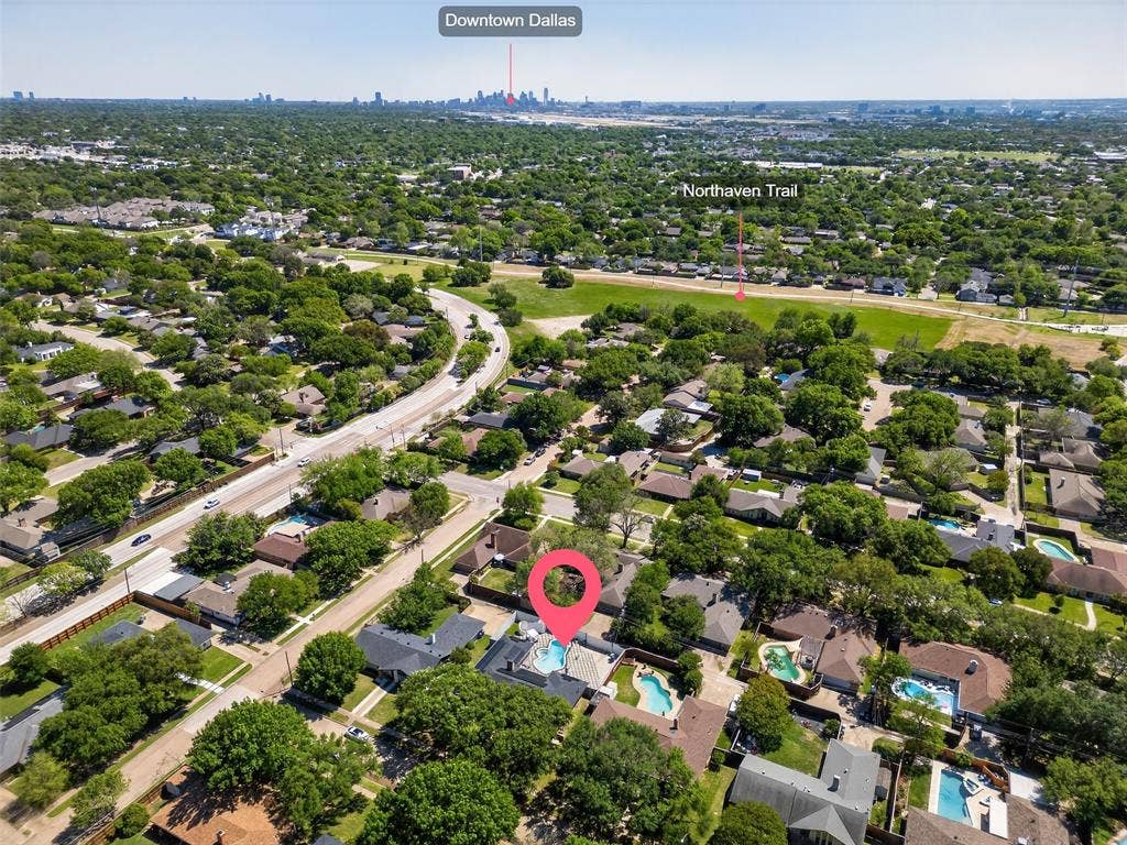 Aerial overview of property's location featuring nearby suburban area